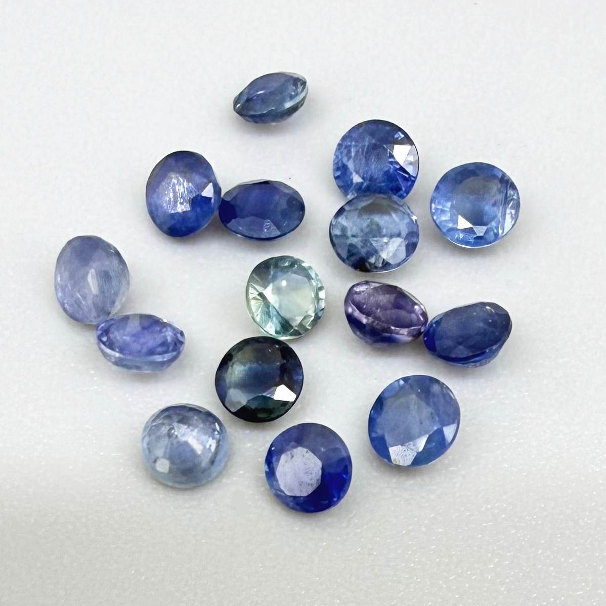 2.8 ct natural sapphire lot from Bangkaja with blue, green and purplish hues, round cut stones.