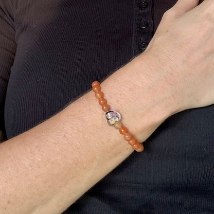 Agate beaded bracelet, 16cm, orange gemstone beads with glass heart focal bead on elastic stretch band.