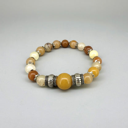 Jade beaded bracelet, 18cm, beige, orange, and brown gemstone beads with larger focal bead and two metal accents on elastic stretch band.