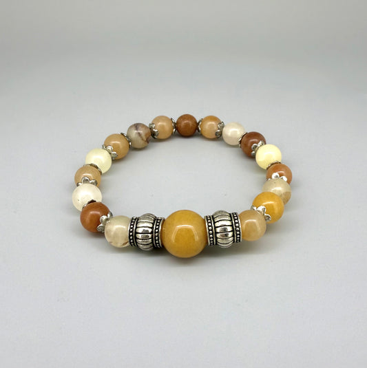 Jade beaded bracelet, 18cm, beige, orange, and brown gemstone beads with larger focal bead and two metal accents on elastic stretch band.