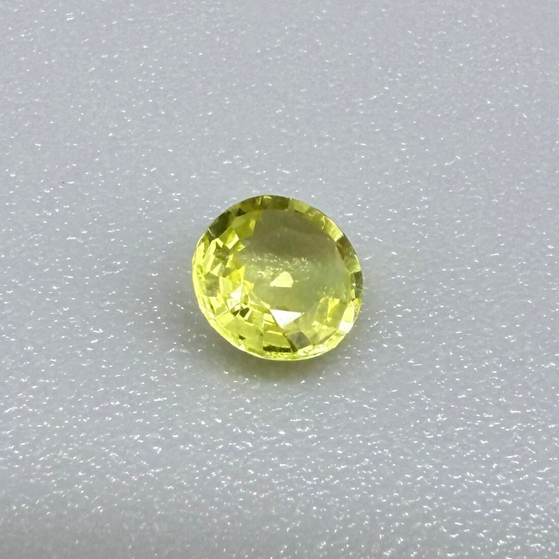0.28 ct natural yellow sapphire from Bangkaja, round cut.