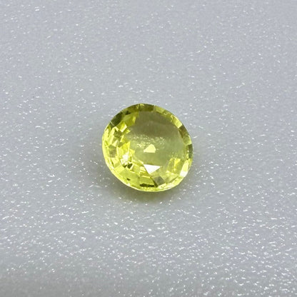 0.28 ct natural yellow sapphire from Bangkaja, round cut.