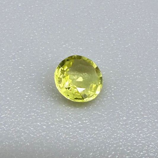 0.28 ct natural yellow sapphire from Bangkaja, round cut.