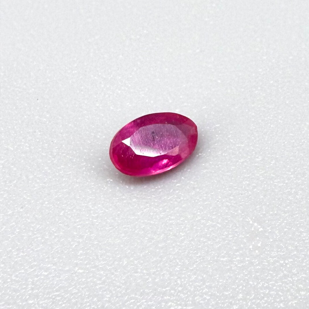 0.32 ct natural pink-red Songea ruby, oval cut.