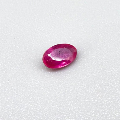 0.32 ct natural pink-red Songea ruby, oval cut.