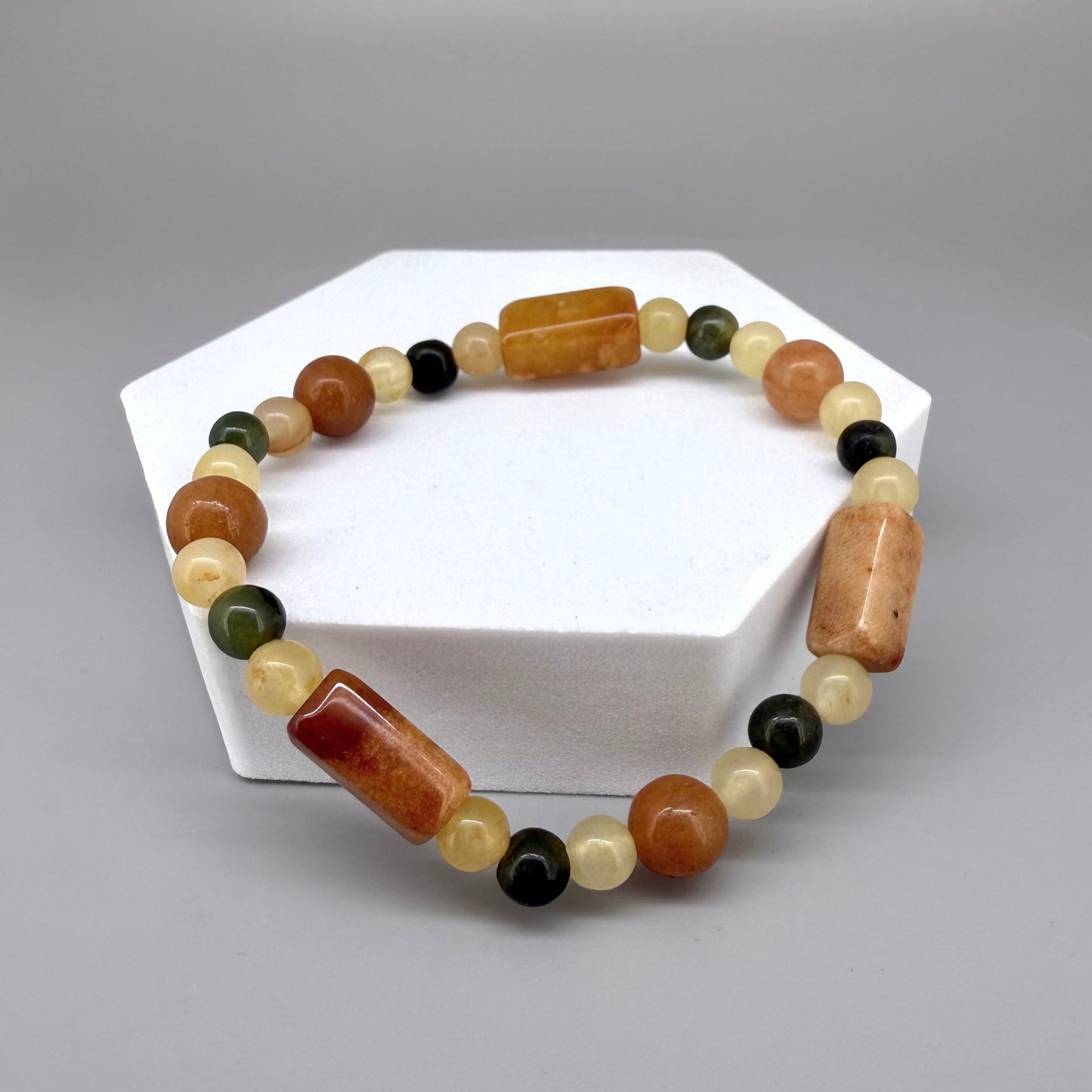 Jade beaded bracelet, 19cm, orange square stones with round beads in orange, green, and beige tones on elastic stretch band.