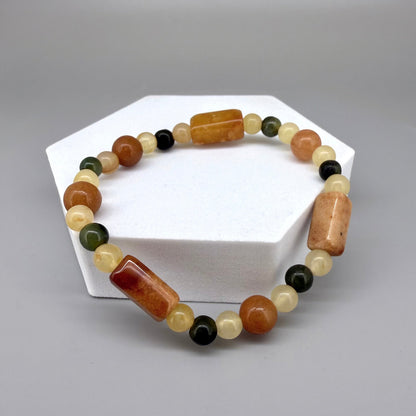 Jade beaded bracelet, 19cm, orange square stones with round beads in orange, green, and beige tones on elastic stretch band.