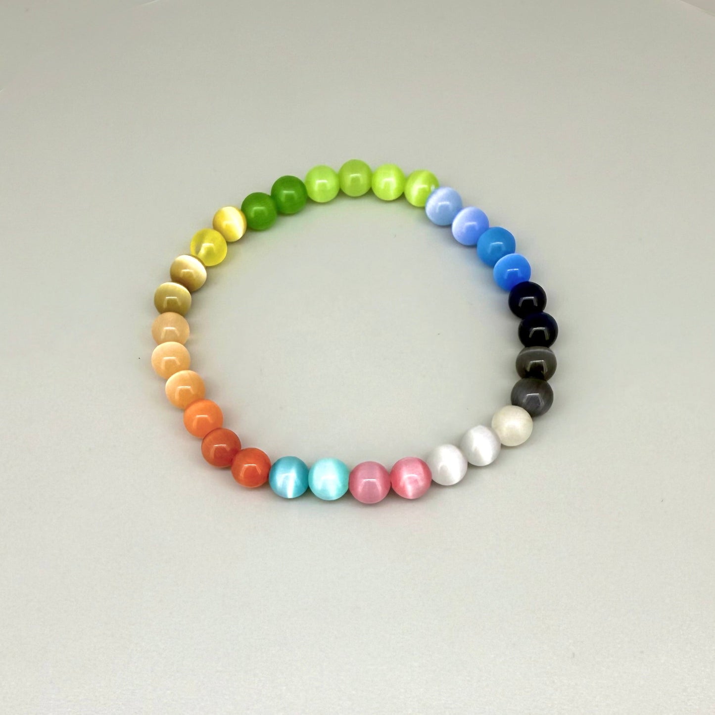 Cat’s Eye multicolor beaded bracelet, 18cm, natural gemstone beads with shimmering light effect on elastic stretch band.