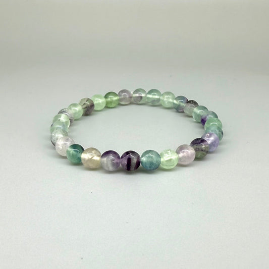 Fluorite beaded bracelet, 18cm, natural gemstone beads in mixed pastel tones on elastic stretch band.