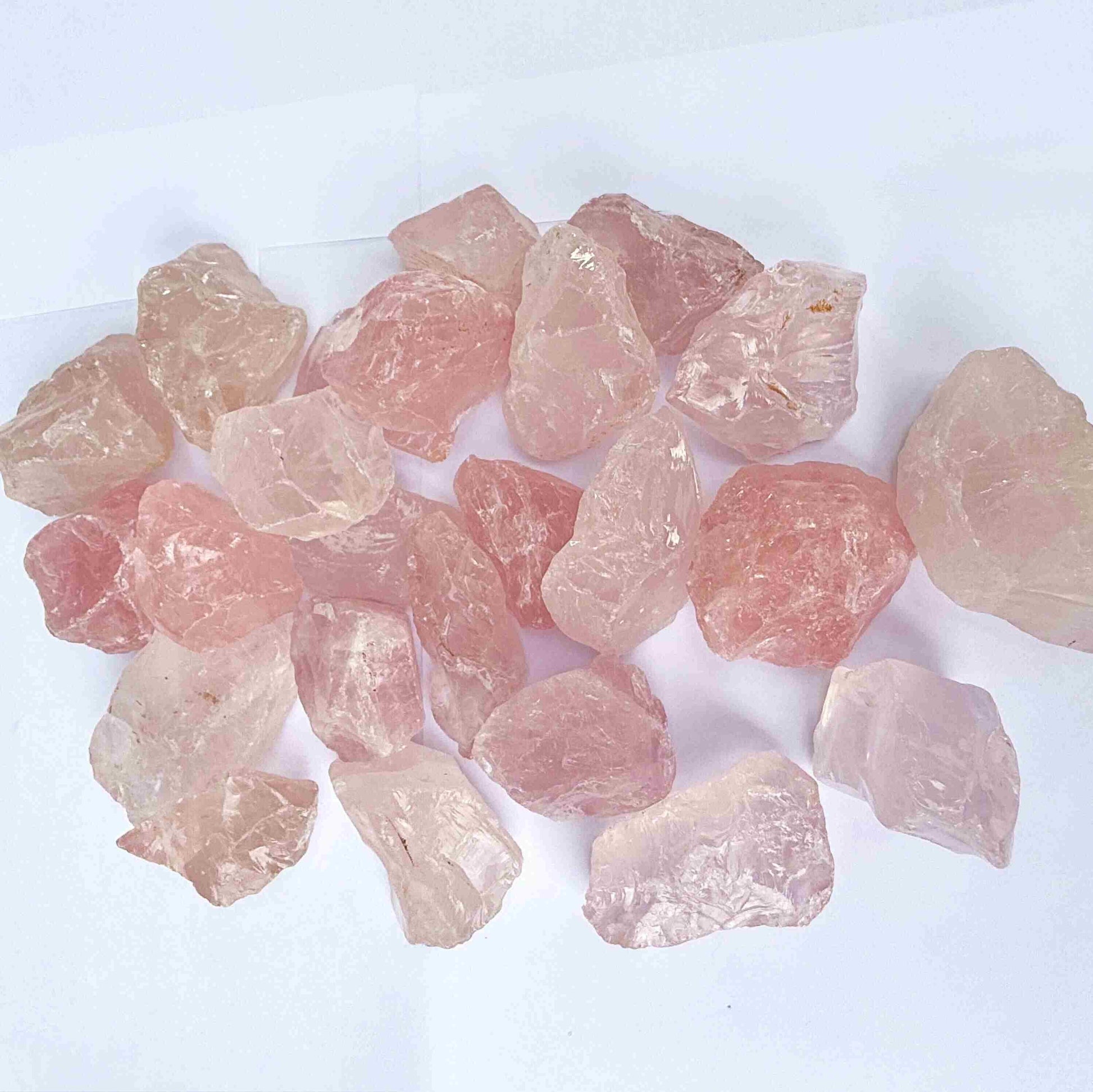 Natural rose quartz rough stones, untreated pink quartz in raw form for lapidary and jewelry projects