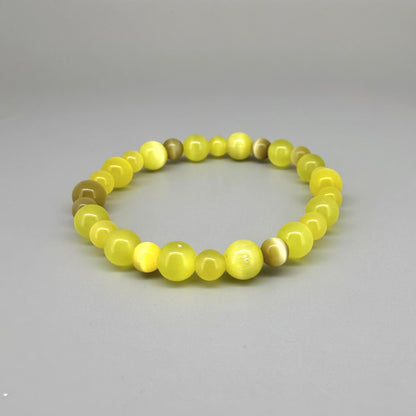 Yellow cat’s eye beaded bracelet, 18cm, shimmering yellow beads with brown accent stones on elastic stretch band.