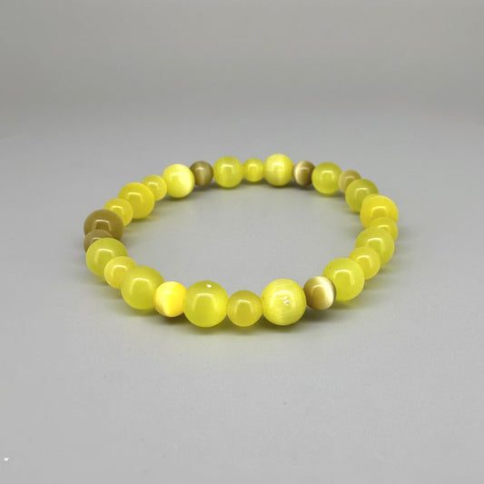 Yellow cat’s eye beaded bracelet, 18cm, shimmering yellow beads with brown accent stones on elastic stretch band.