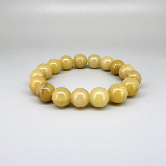 Jade beaded bracelet, 19cm, natural yellow-cream gemstone beads on elastic stretch band.