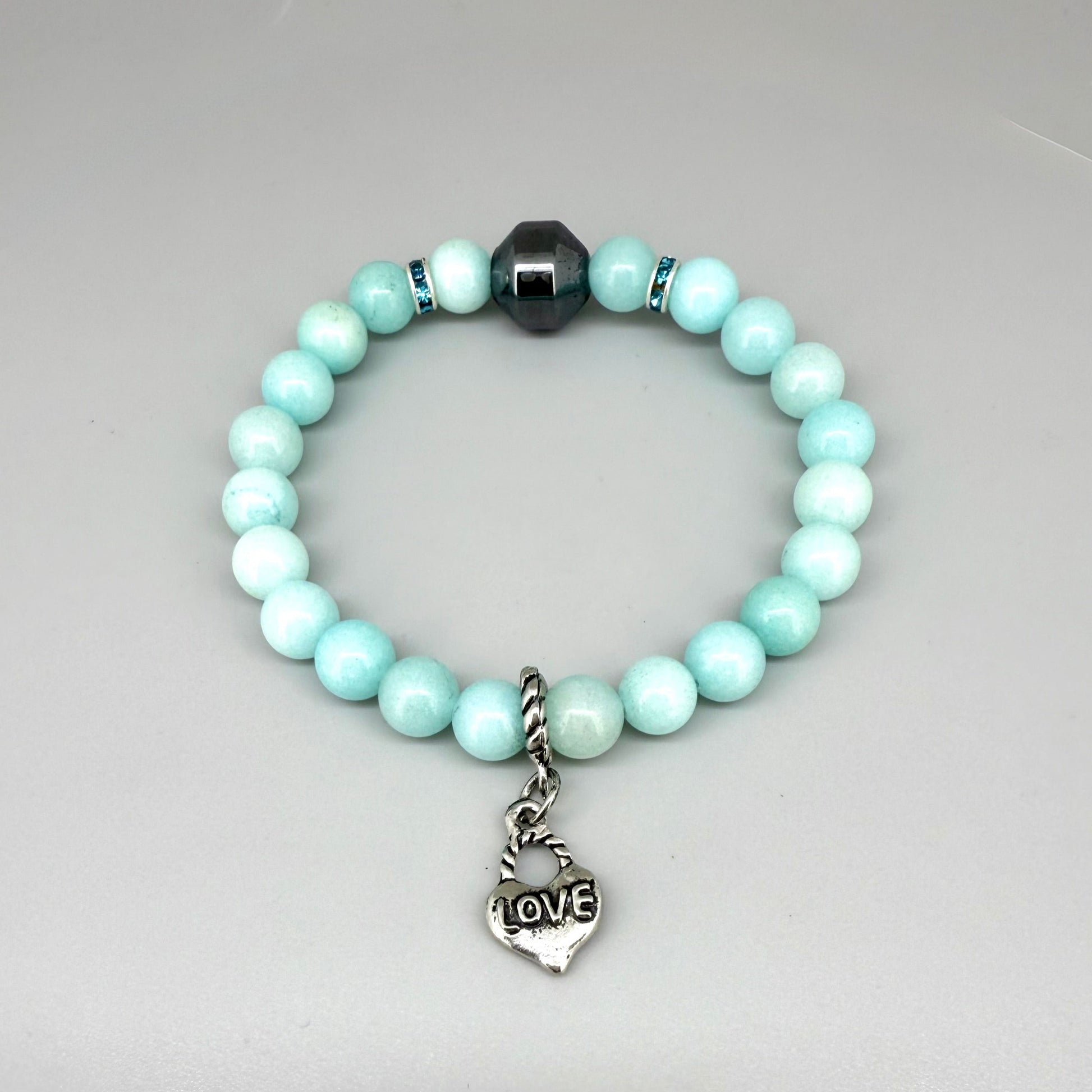 Agate beaded bracelet, 19cm, aqua-blue gemstone beads with decorative medallion accent on elastic stretch band.
