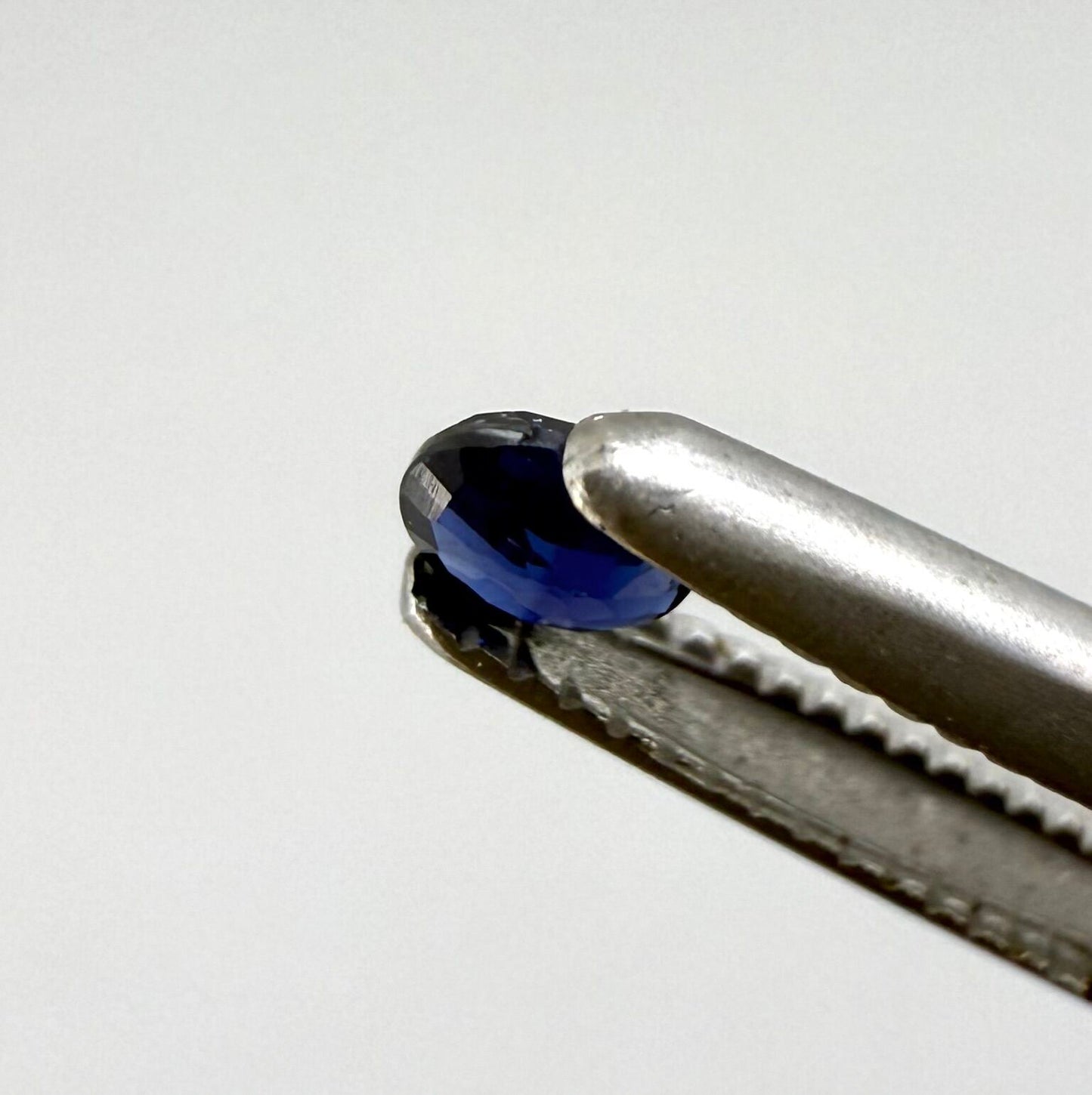 0.09 ct natural blue sapphire from Pailin, Cambodia, oval cut.