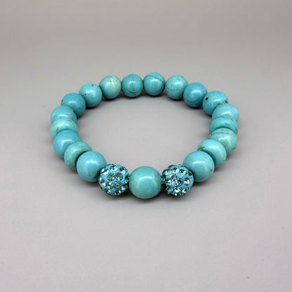 Howlite beaded bracelet, 18cm, white gemstone beads with grey veining and two sparkling accent beads on elastic stretch band.