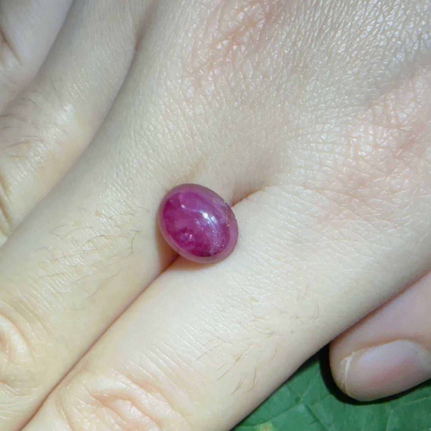 4.62 ct natural pink Star Ruby cabochon from Madagascar with soft star effect and polished dome.