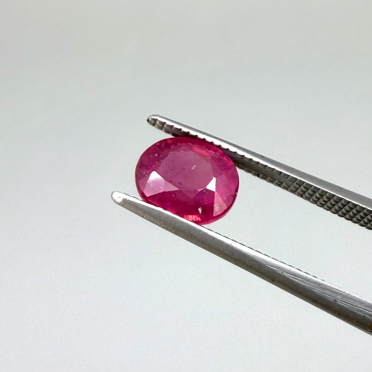 2.1 ct natural pink-red Songea ruby, oval cut.