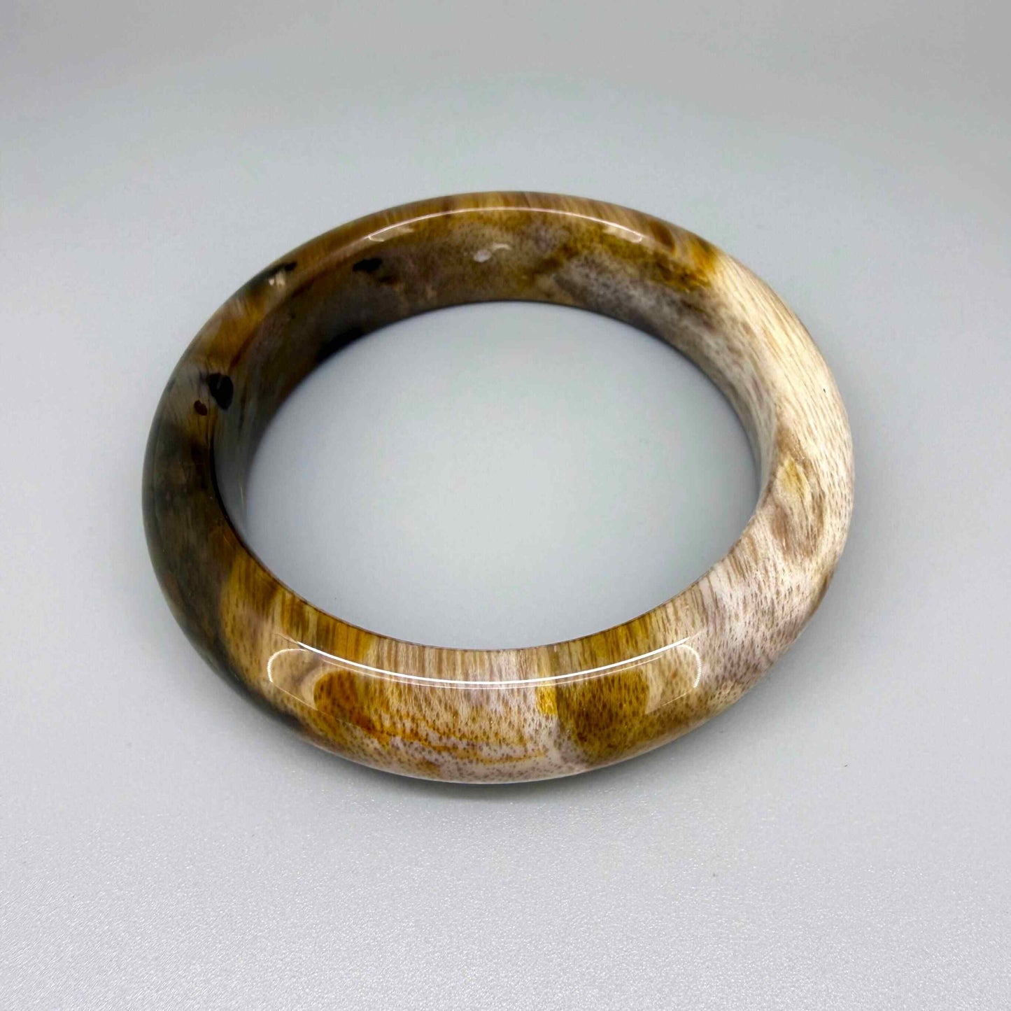 Natural jade bangle bracelet in beige and brown tones, smooth polished finish, 18 cm inner circumference