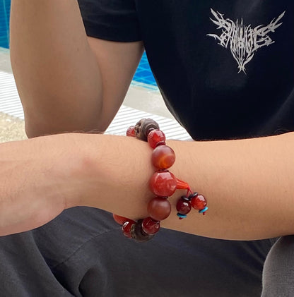 Agate and carnelian beaded bracelet, 20cm, with fiery red, orange, and colorful accent beads on elastic stretch band.
