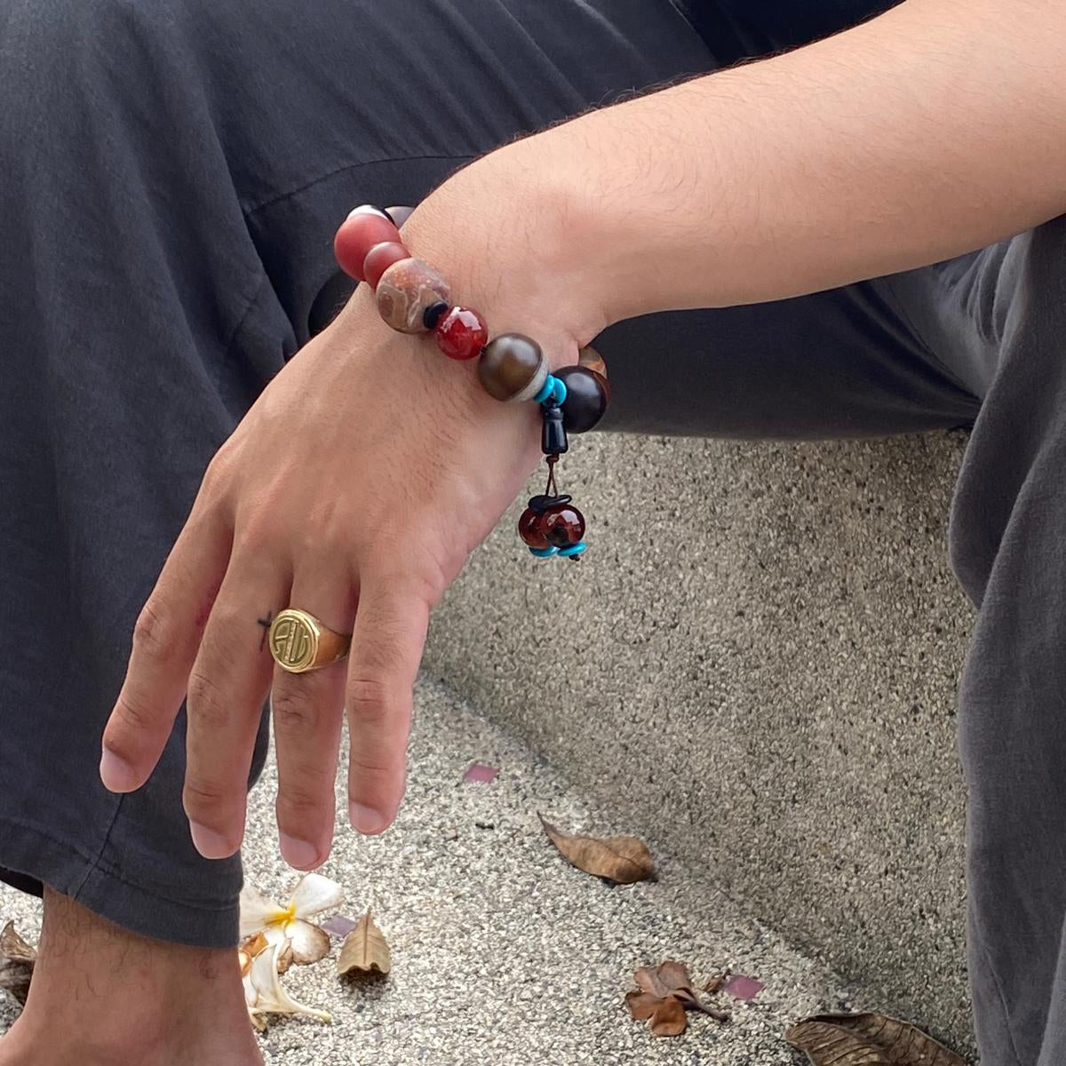 Agate and carnelian beaded bracelet, 20cm, with fiery red, brown, and colorful accent beads on elastic stretch band.