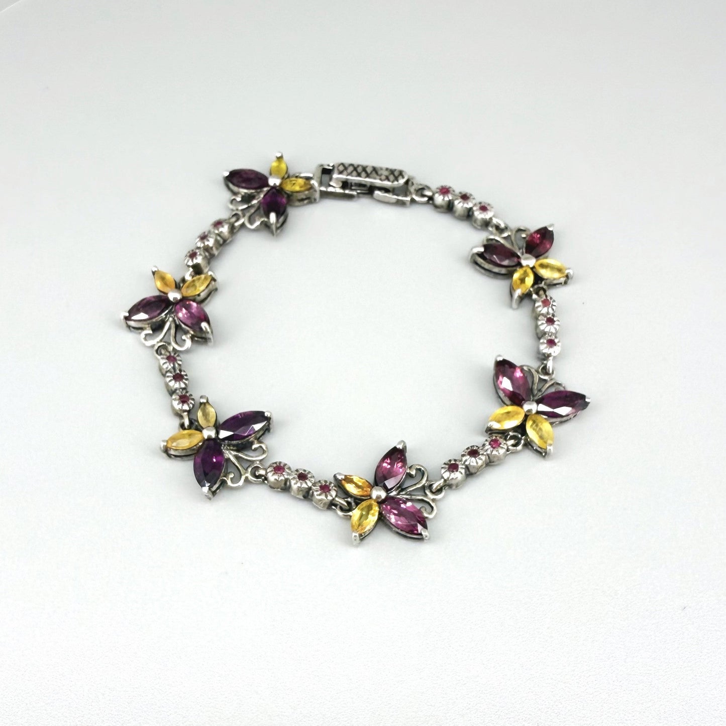 Gem Butterfly bracelet with rhodolite, sapphire and ruby gemstones set in white gold plated silver