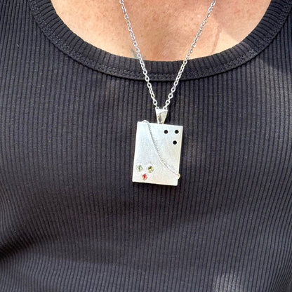 Handcrafted rectangular silver pendant with three natural tourmalines in green, pink, and yellow (2.16 ct total).