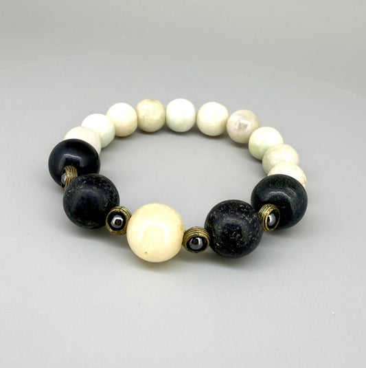 White jade, onyx, and hematite beaded bracelet, 18cm, natural white, black, and metallic grey gemstone beads with smaller hematite accents on elastic stretch band.