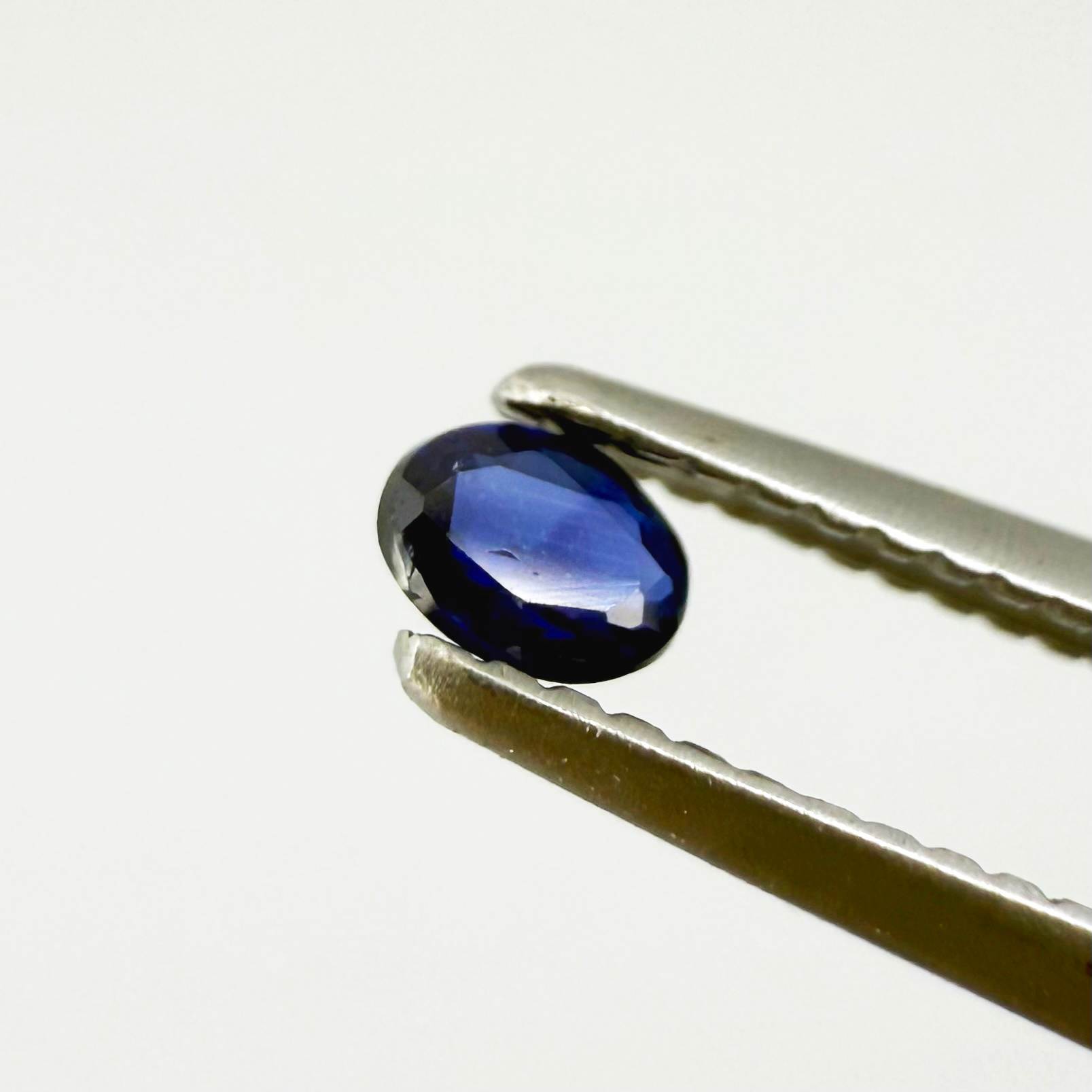 0.09 ct natural blue sapphire from Pailin, Cambodia, oval cut.