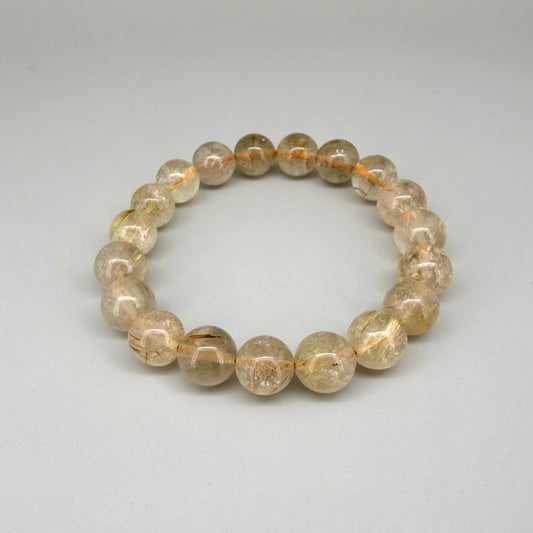 Bronze rutilated quartz beaded bracelet, 18cm, natural gemstone beads with bronze rutile threads on elastic stretch band.