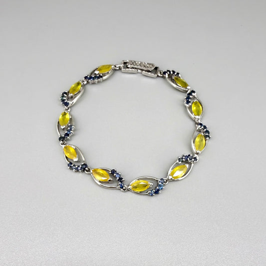 Sapphire bracelet with yellow and blue gemstones set in white gold plated silver