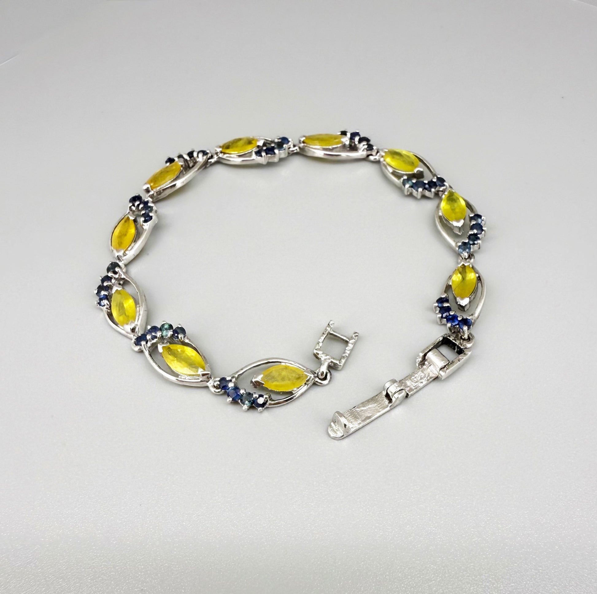 Sapphire bracelet with yellow and blue gemstones set in white gold plated silver