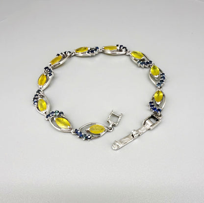 Sapphire bracelet with yellow and blue gemstones set in white gold plated silver