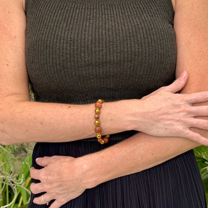 Hematite and goldstone beaded bracelet, 18cm, metallic gold and shimmering golden-copper beads on elastic stretch band.