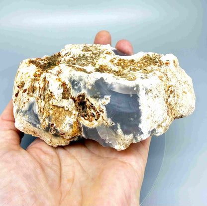 Untreated grey-blue chalcedony rough (quartz) stone with cloudy milky texture