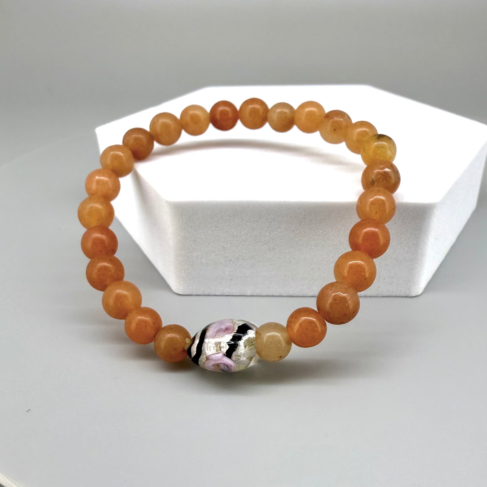 Agate beaded bracelet, 16cm, orange gemstone beads with glass heart focal bead on elastic stretch band.