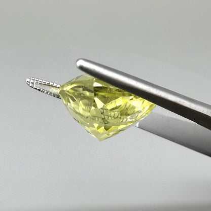 8 ct natural lemon quartz, trillion cut with bright yellow color.