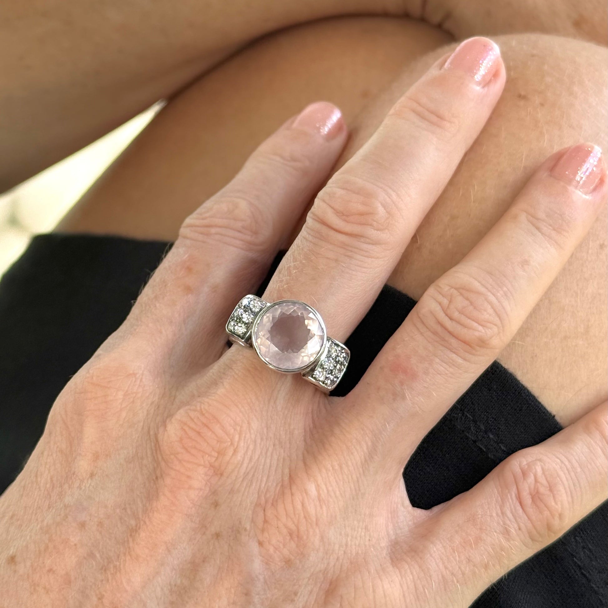 Rose quartz and CZ ring in white gold plated sterling silver, featuring a natural pink gemstone with clear sparkling accents, elegant and feminine design.