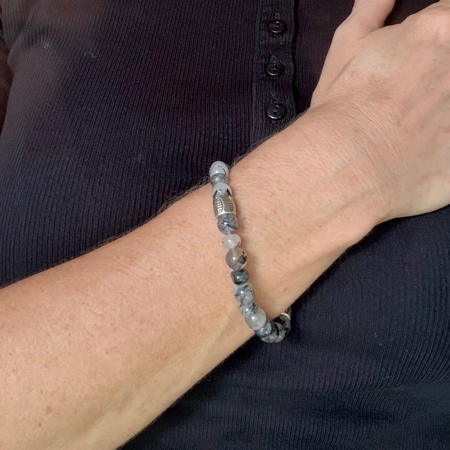 Rutilated quartz beaded bracelet, 18cm, black-white-grey gemstone beads with two decorated metal spacers on elastic band.