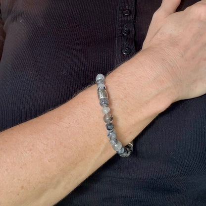 Rutilated quartz beaded bracelet, 18cm, black-white-grey gemstone beads with two decorated metal spacers on elastic band.