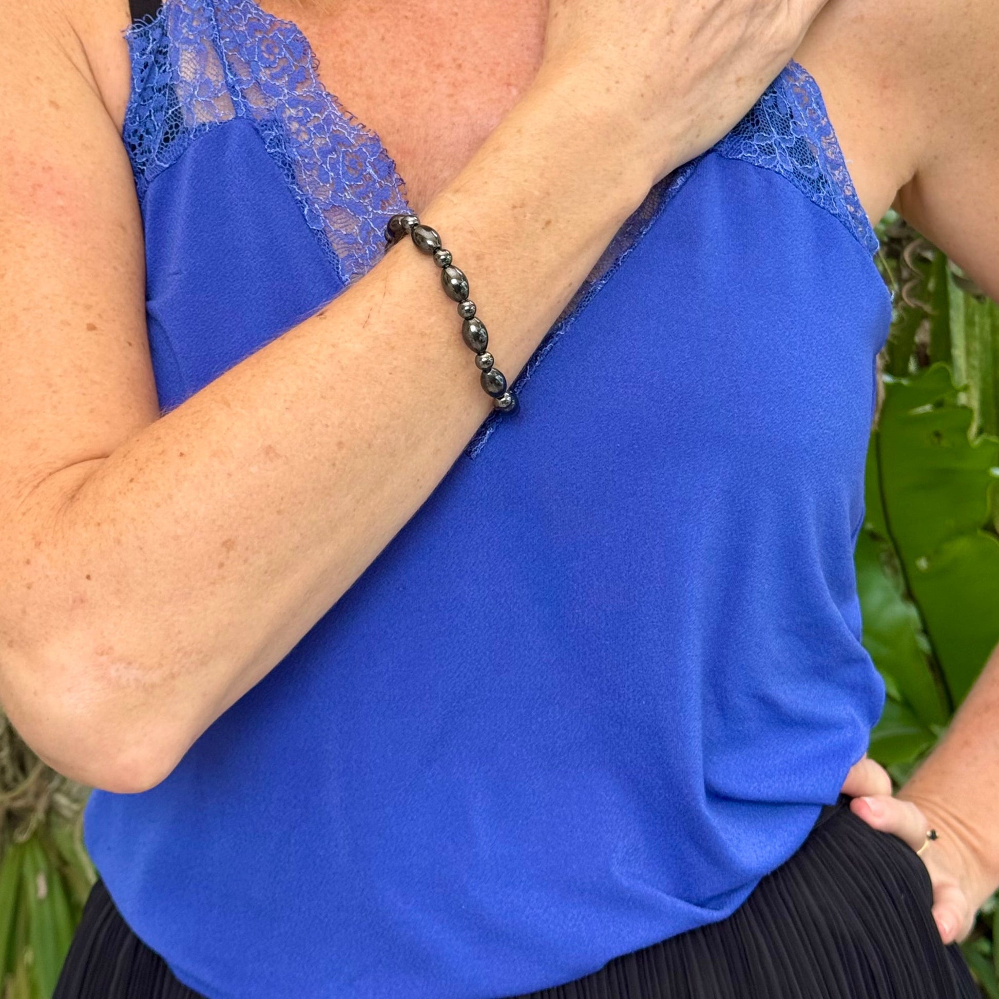 Hematite beaded bracelet, 19cm, dark metallic grey magnetic gemstone beads on elastic stretch band.