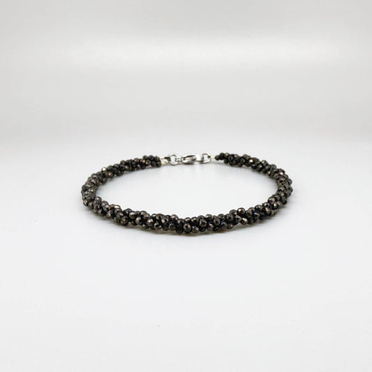 20 cm beaded bracelet made of faceted near-black hematite with a lobster clasp, displayed on a light background.