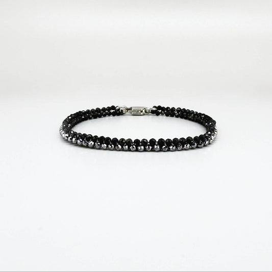 18 cm bracelet made from faceted black spinel and silver hematite beads with a lobster clasp.