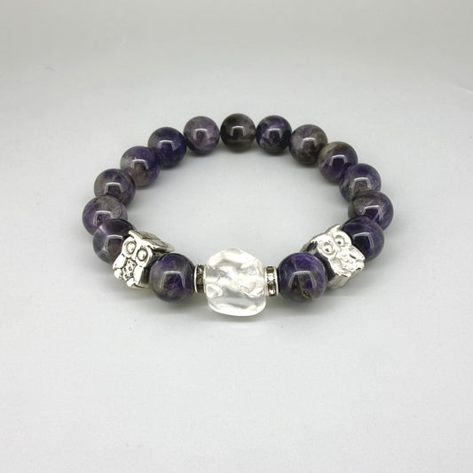 Amethyst beaded bracelet, 18cm, violet gemstone beads with large clear white focal stone and two owl accents on elastic stretch band.
