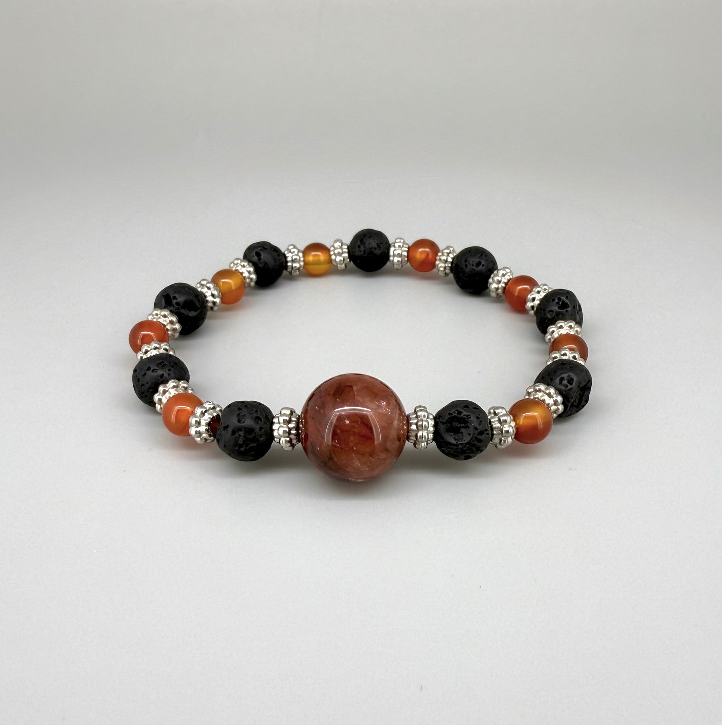 Alt-Text

Carnelian, lava, and cherry quartz beaded bracelet, 18cm, natural orange-red, matte black, and pink beads on elastic stretch band.