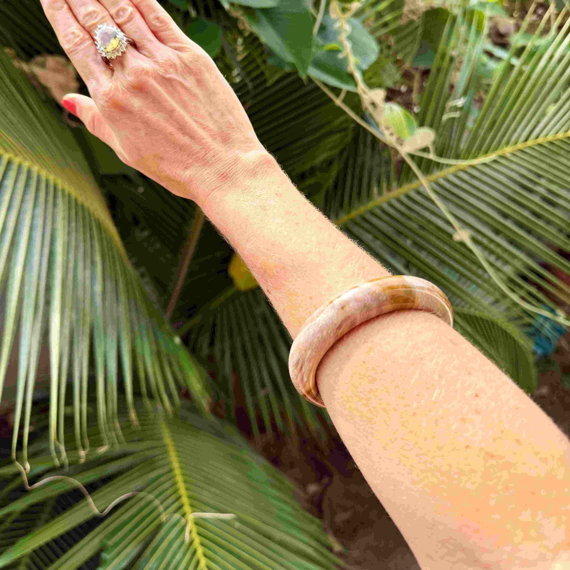 Natural jade bangle bracelet in beige and brown tones, smooth polished finish, 18 cm inner circumference