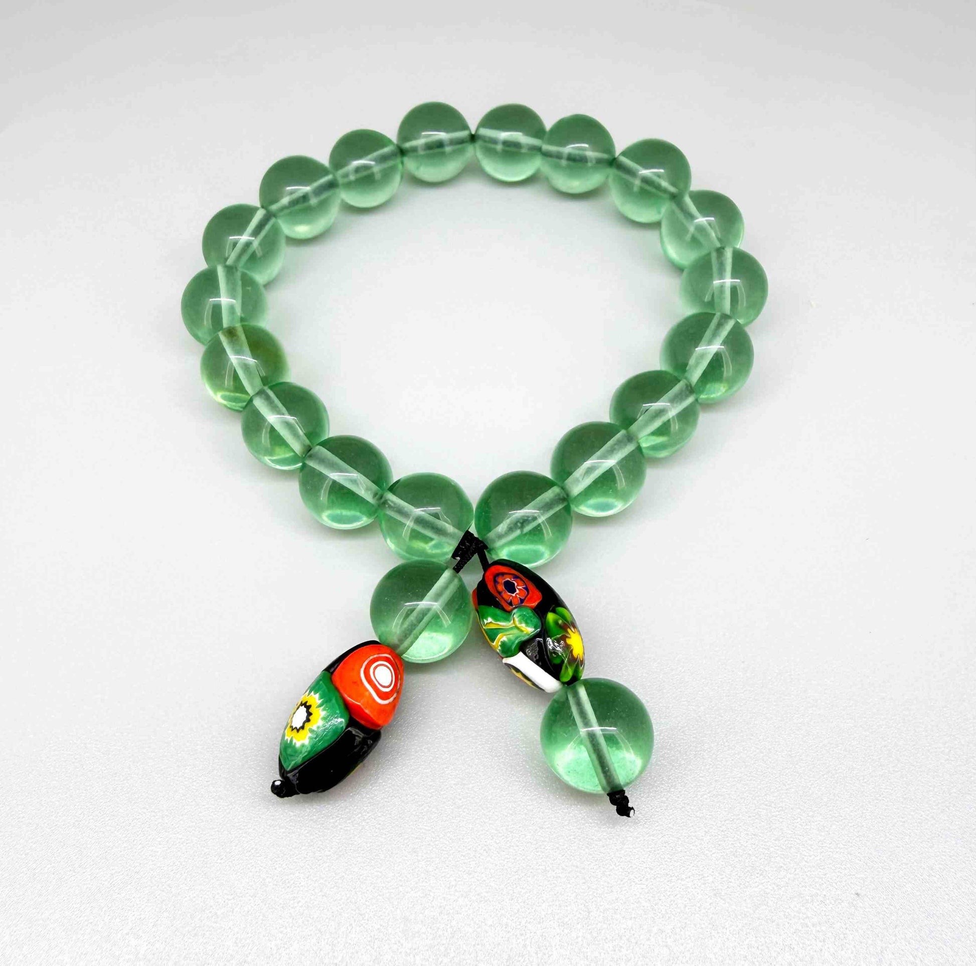 Green quartz mala bracelet made from natural green quartz beads, symbolizing balance, renewal, and emotional harmony.