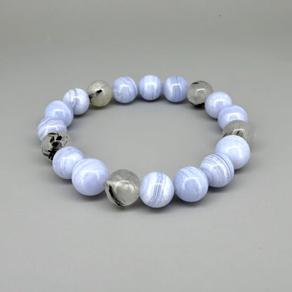 Chalcedony and rutilated quartz beaded bracelet, 18cm, light blue and grey gemstone beads with rutile inclusions on elastic stretch band.