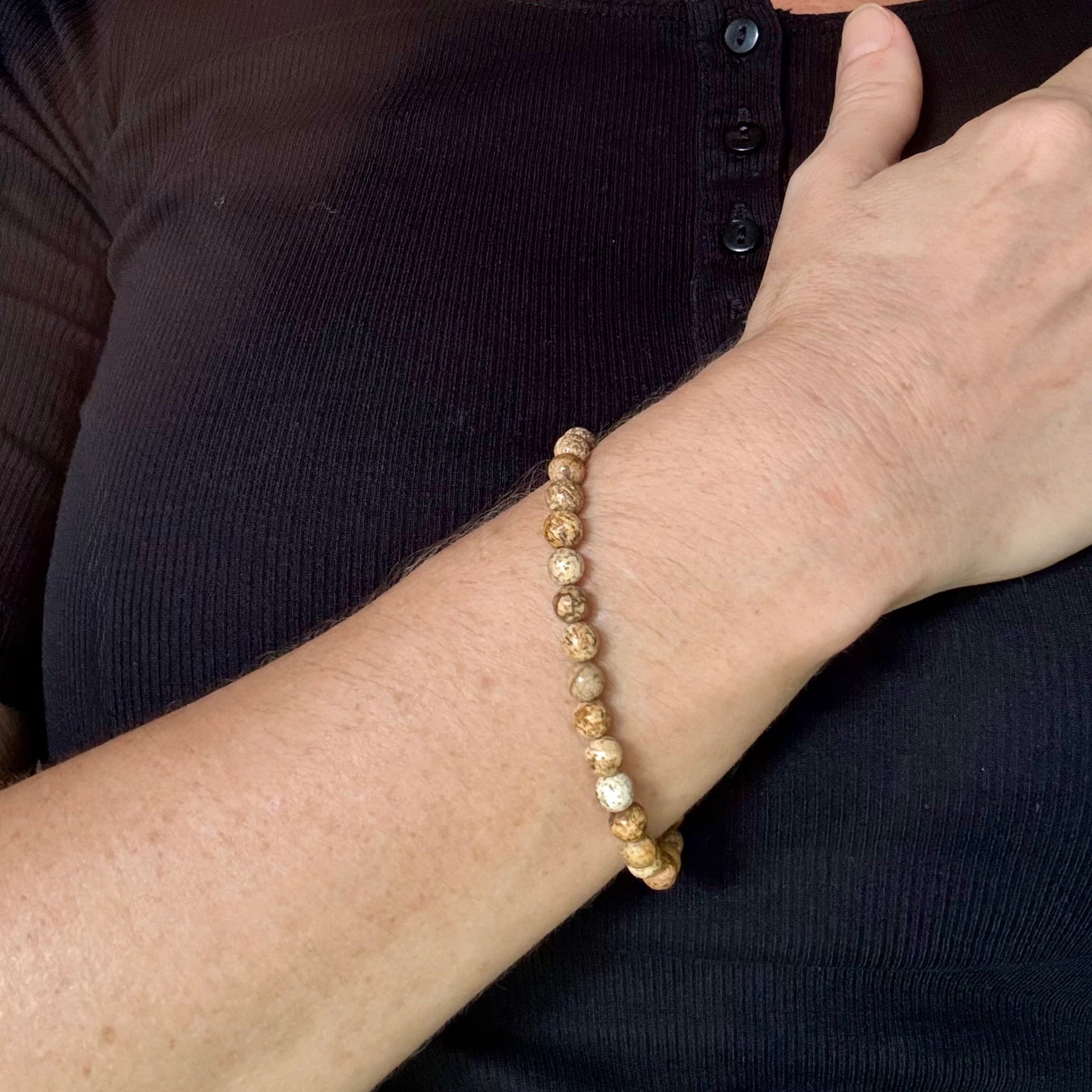 Jasper beaded bracelet, natural gemstone beads in light earthy tones on elastic stretch band.