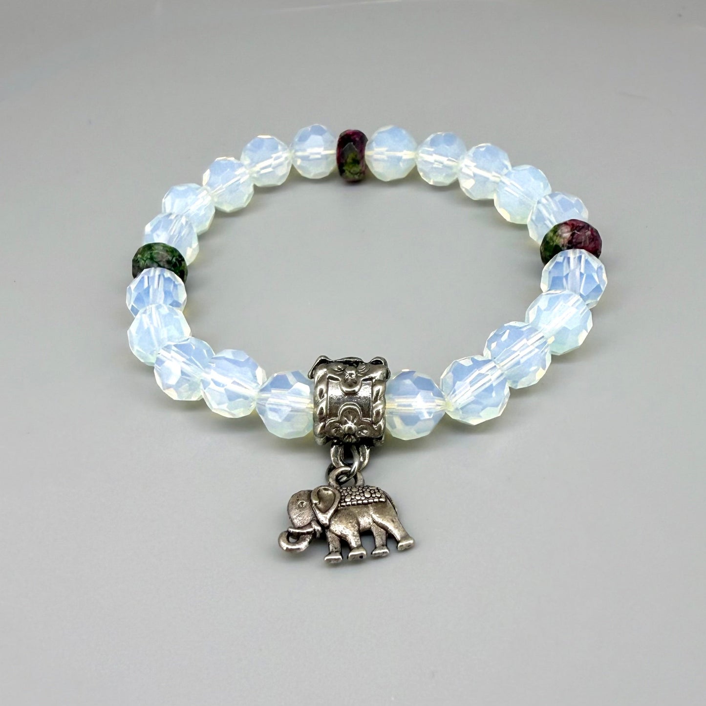 Opal and rhodochrosite beaded bracelet, 17cm, light crystal-blue and soft pink gemstone beads on elastic stretch band.